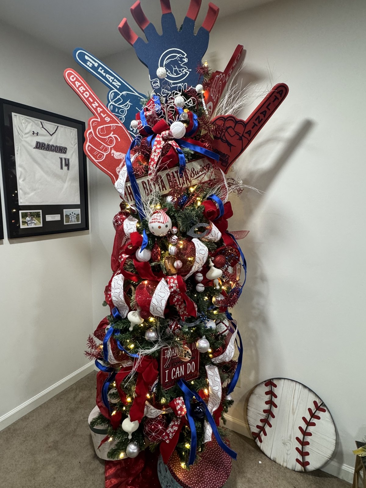 Custom themed Christmas tree with team ribbon and keepsake ornaments